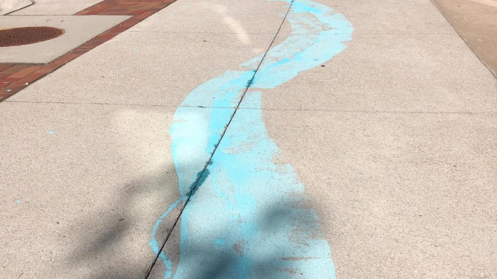 chalk stream painted through downtown grand island for the flood control stroll