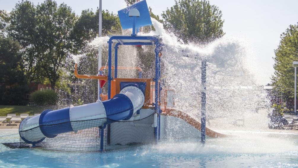 aquatic play zone with dump bucket pouring out water