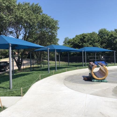 venture park splash pad seating area with shade